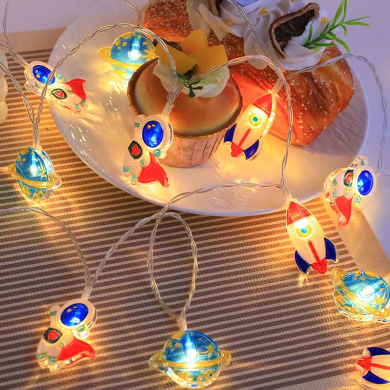 Decorative string lights on a plate with pastries.