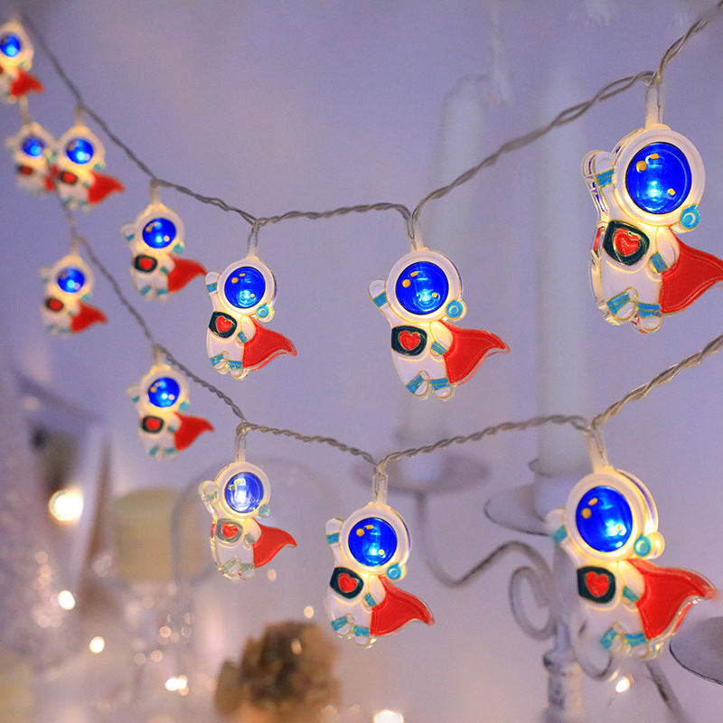 String lights with heroic astronaut designs on a blurred background