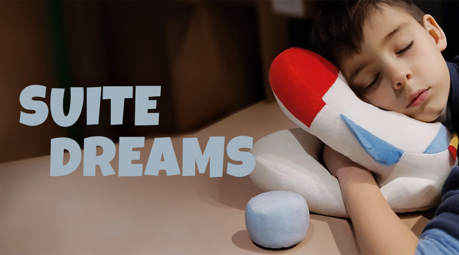 Child holding a plush toy with 'Suite Dreams' text in the foreground