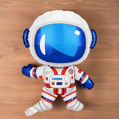 Balloon shaped like an astronaut on a wooden surface