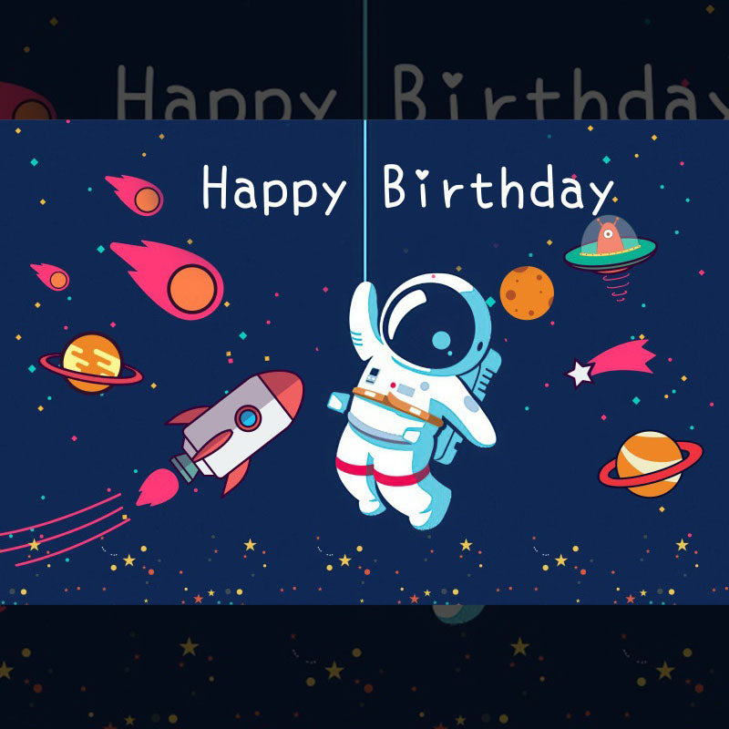 Happy Birthday backdrop with an astronaut, planets, and a rocket in space-themed design.