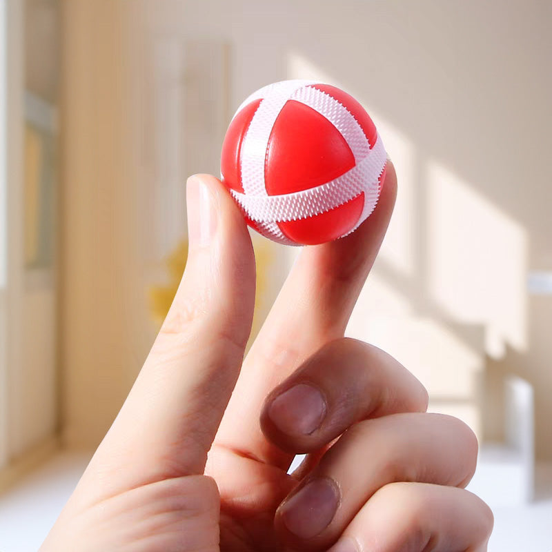 Close-up of a red velcro ball held on hand - The Dart Knight™